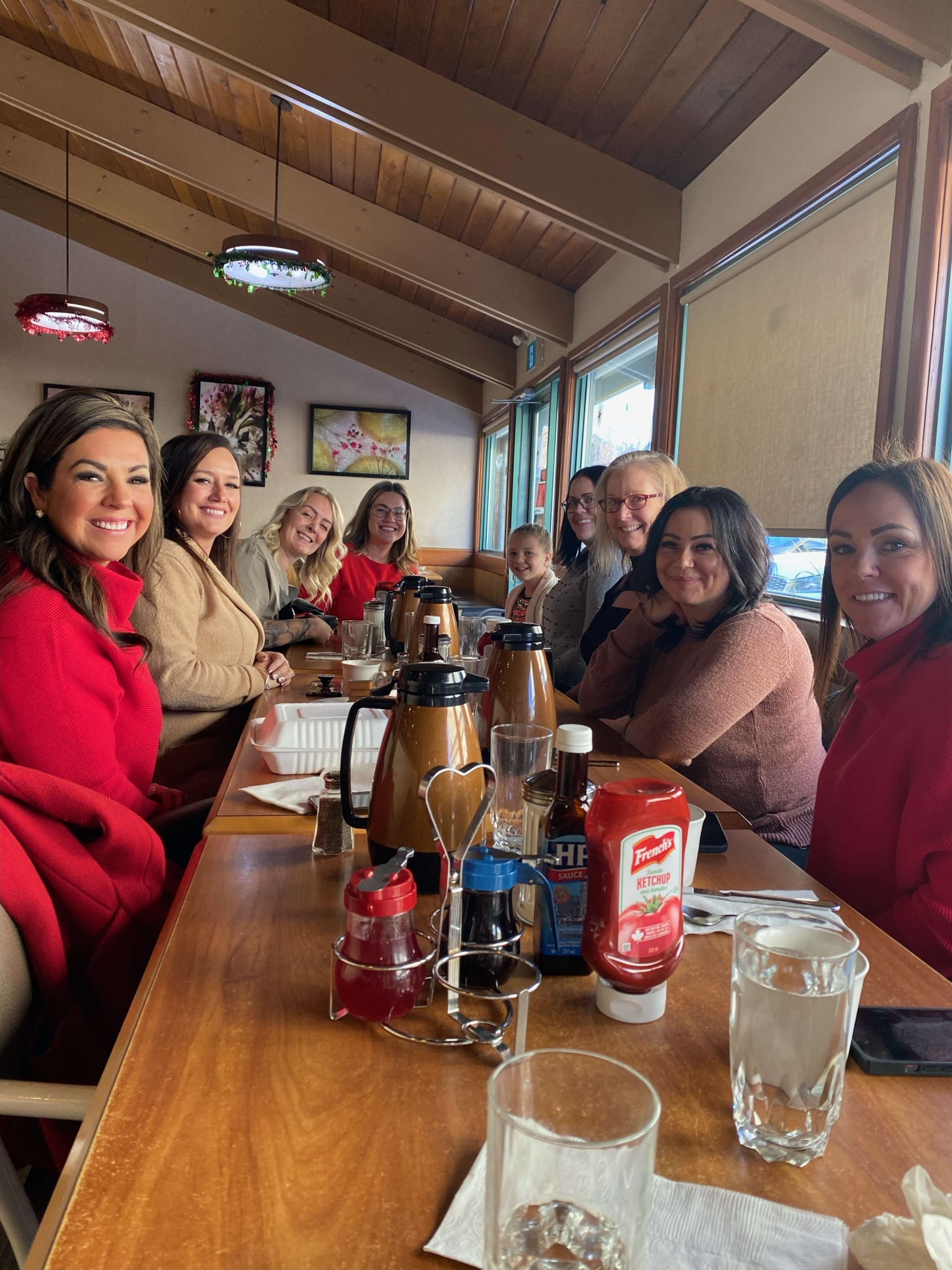 TPTM team members seated at a table in a restaurant