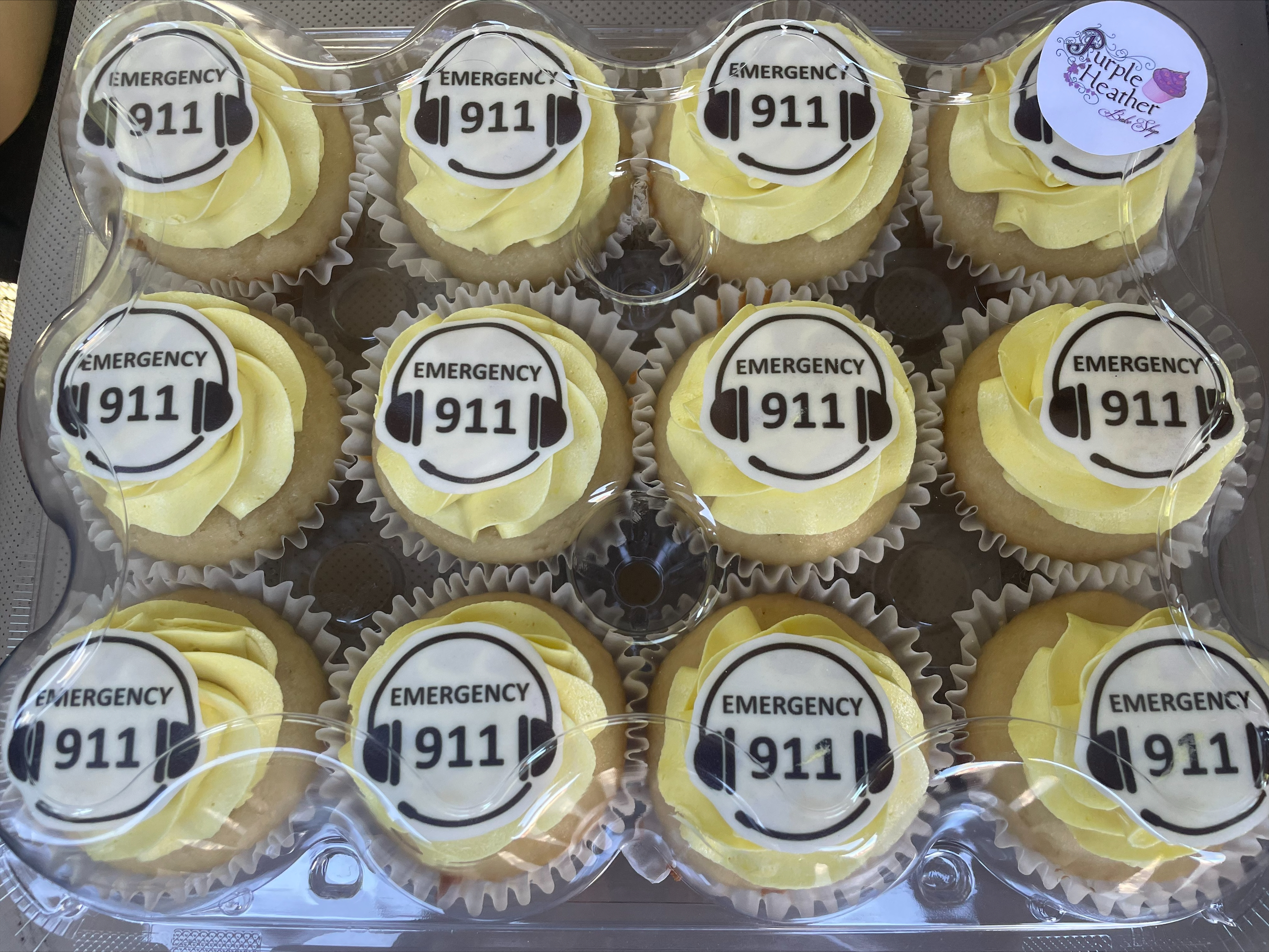 alt="Cupcakes with yellow icing with Emergency 911 written on top"